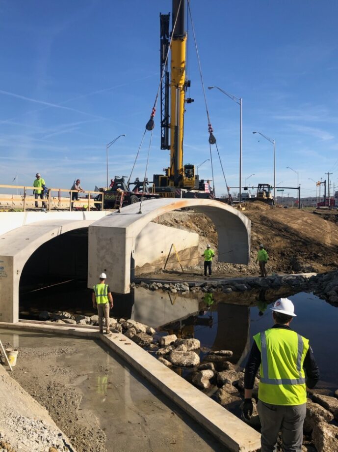 construction crew placing cement blocks